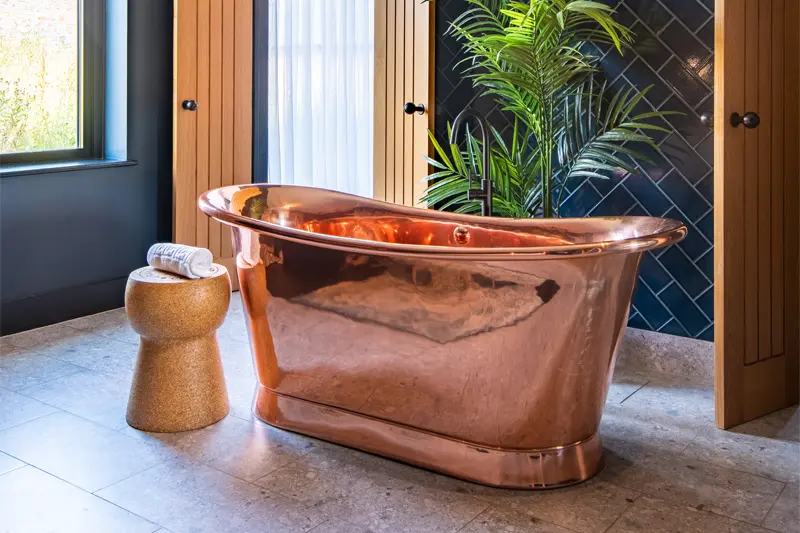 Copper free standing bath in accommodation.